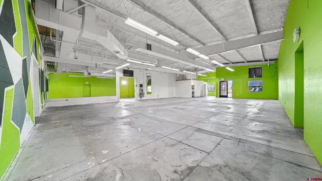 a bathroom with a toilet a sink a mirror and vanity