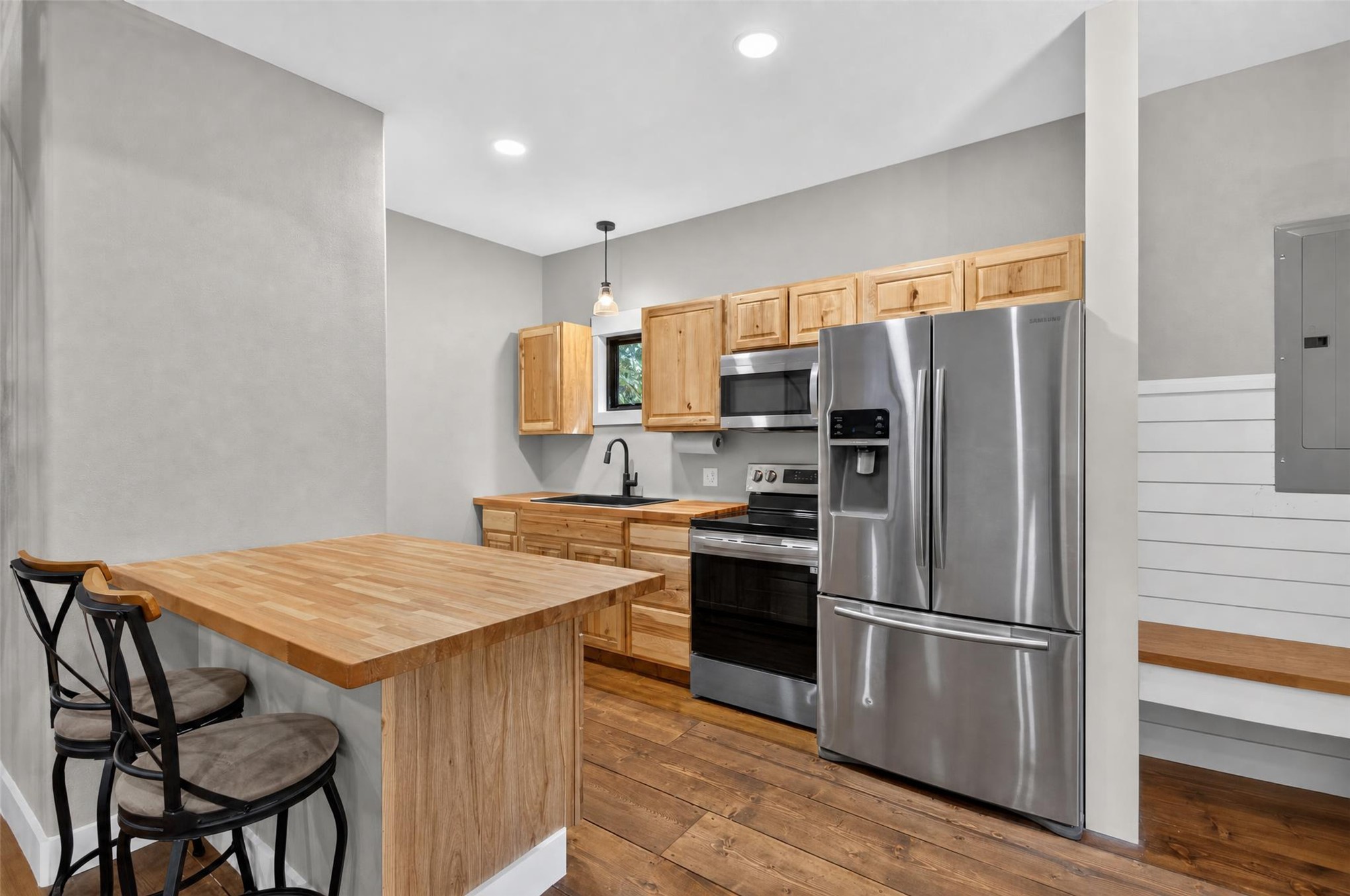 13063 East 403 Road Spavinaw, OK 74366 - Photo 7 of 25 Hardwood-finish flooring, stainless steel appliances, natural wood cabinetry, wood-finish countertops, and recessed lighting