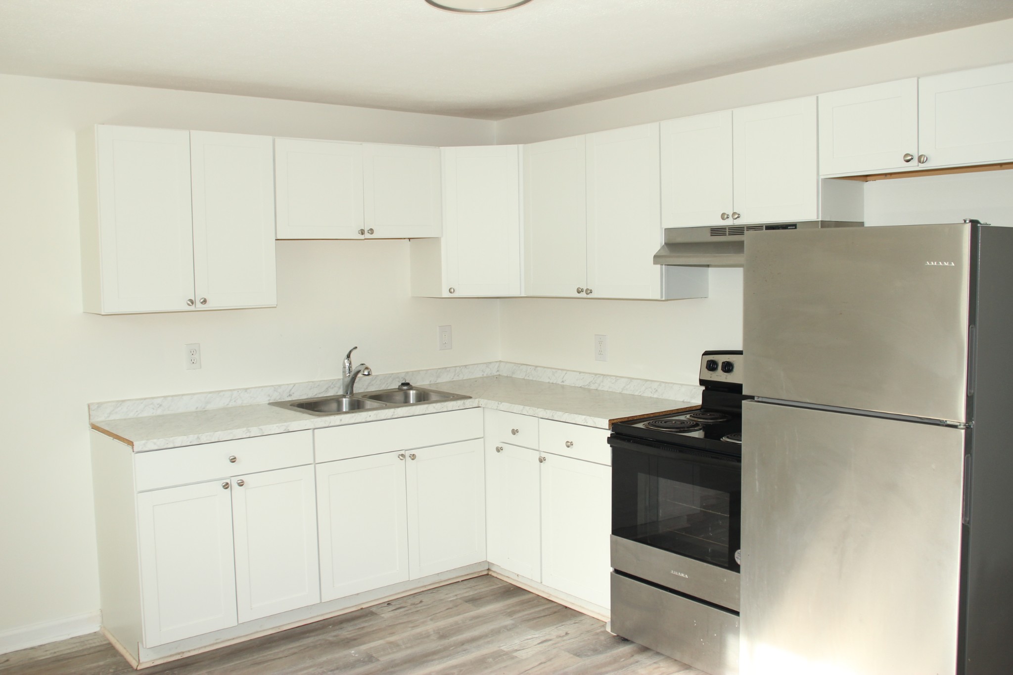 517 Bybee Branch Road, Unit 43 McMinnville, TN 37110 - Photo 4 of 14 a kitchen with appliances a sink and cabinets