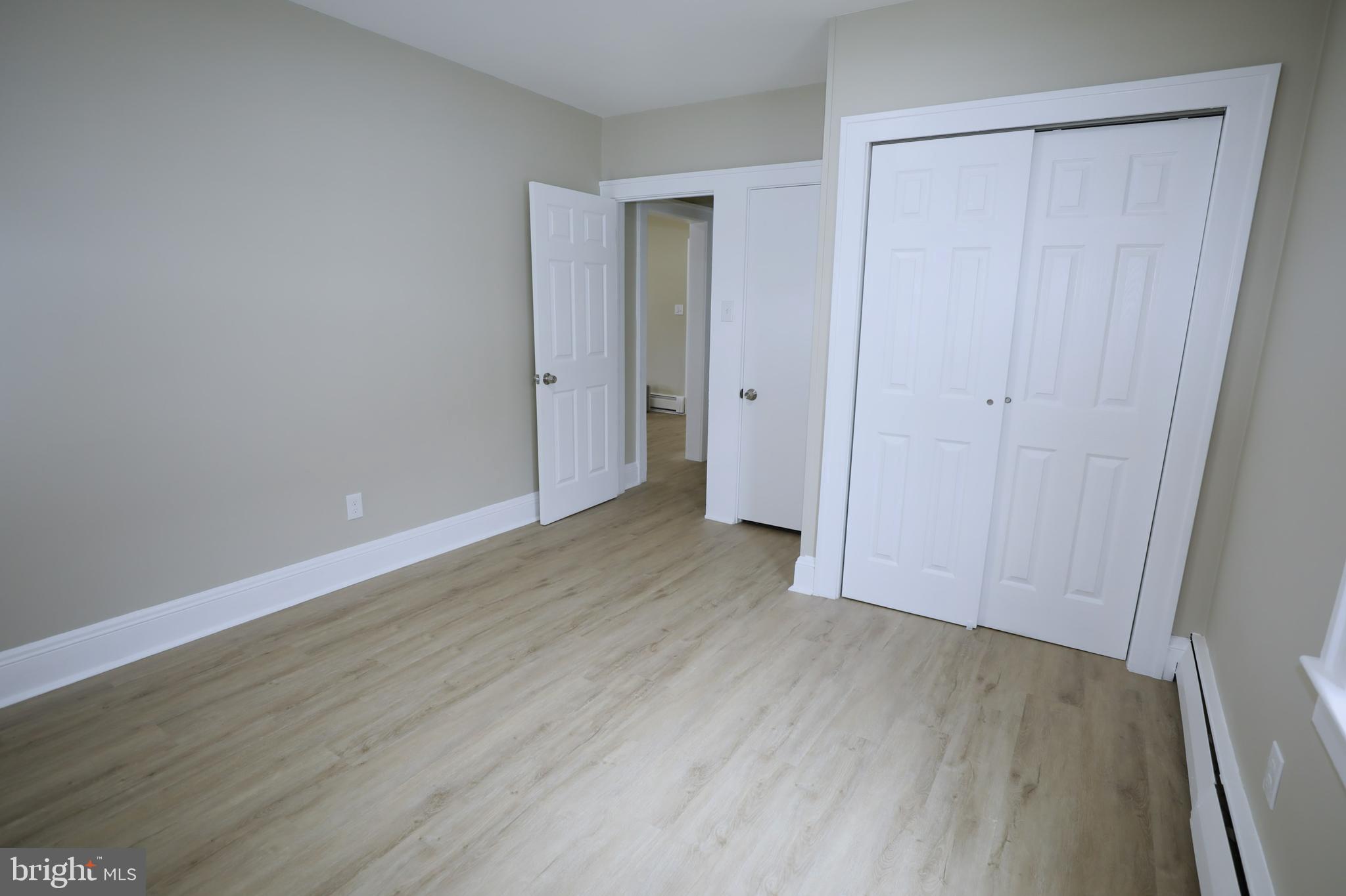 36 Emanuel Street Hamilton, NJ 08610 - Photo 12 of 26 a view of an empty room with wooden floor and closet area
