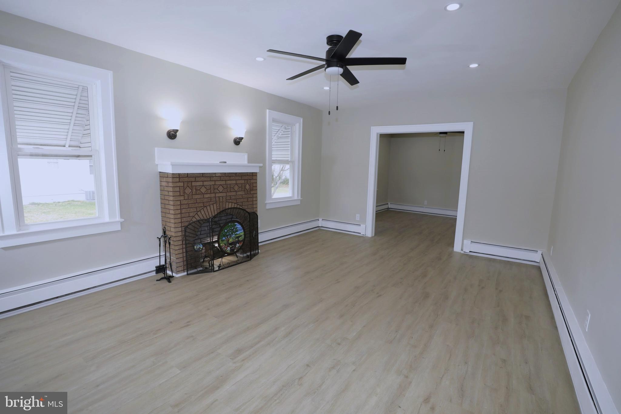 36 Emanuel Street Hamilton, NJ 08610 - Photo 2 of 26 a view of a livingroom with a fireplace and window