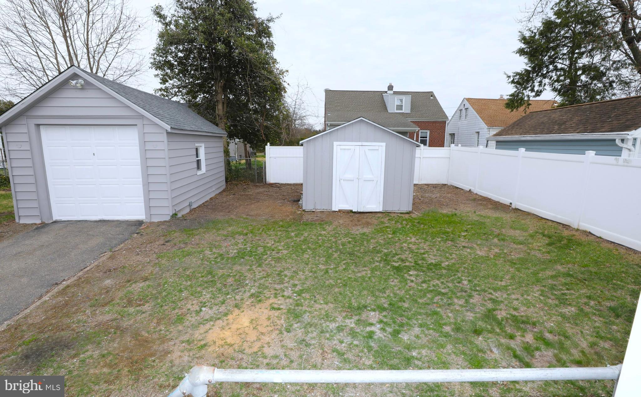36 Emanuel Street Hamilton, NJ 08610 - Photo 23 of 26 a front view of a house with a yard and garage