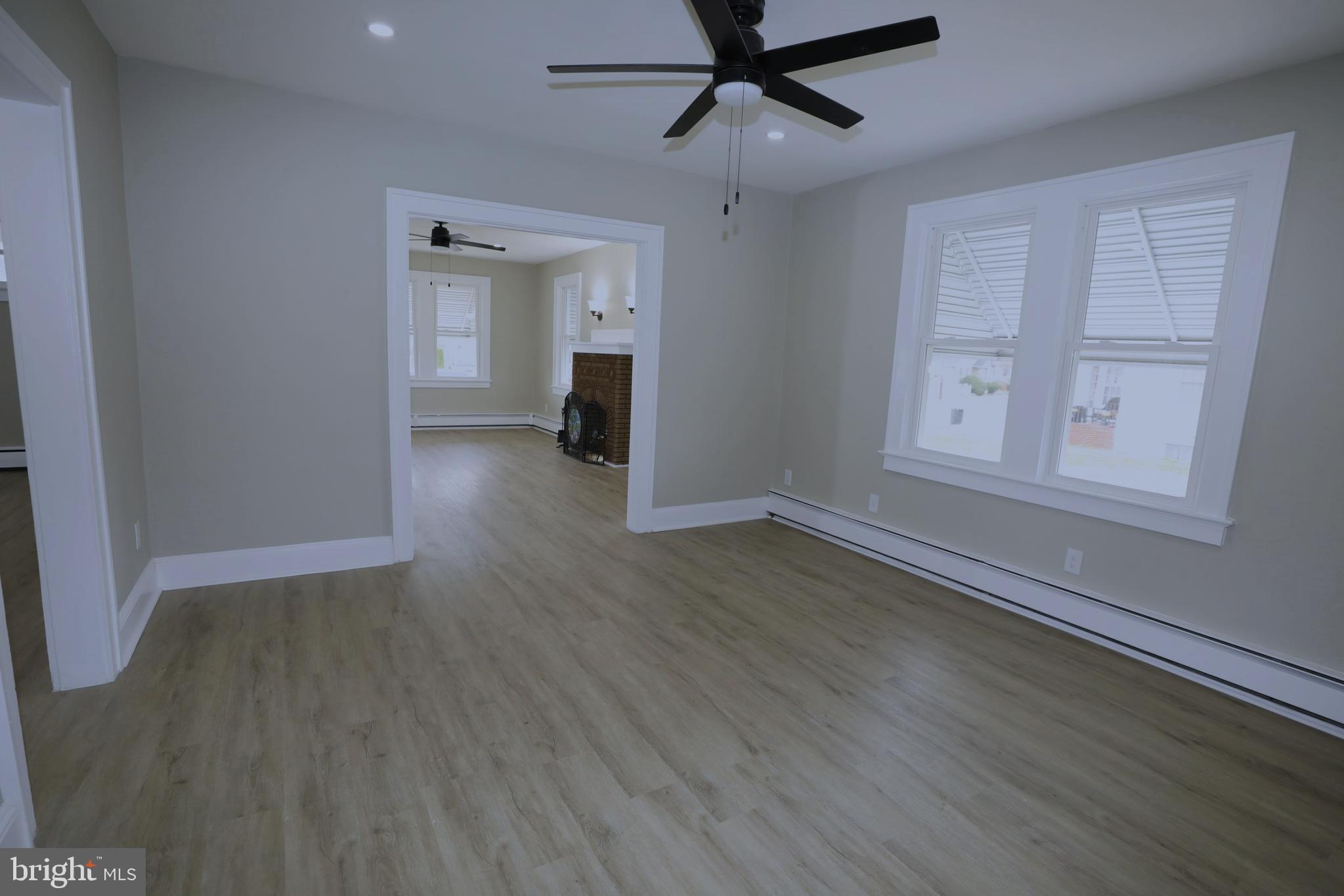 36 Emanuel Street Hamilton, NJ 08610 - Photo 4 of 26 a view of empty room with wooden floor and fan