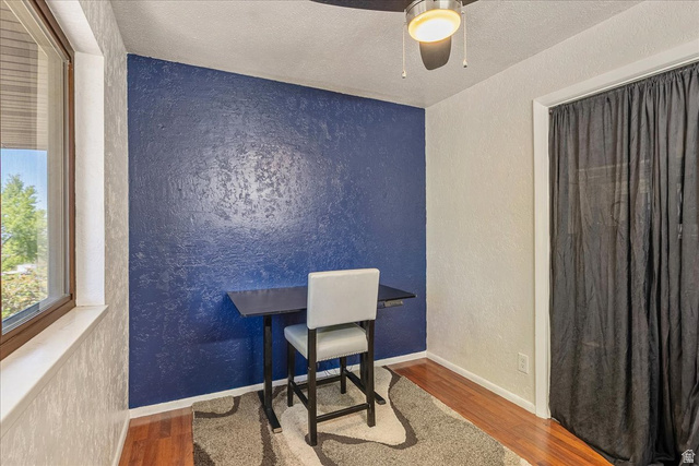 11 South Clark Lane Elk Ridge, UT 84651 - Photo 21 of 46 Office space with a textured wall, wood finished floors, a textured ceiling, and ceiling fan