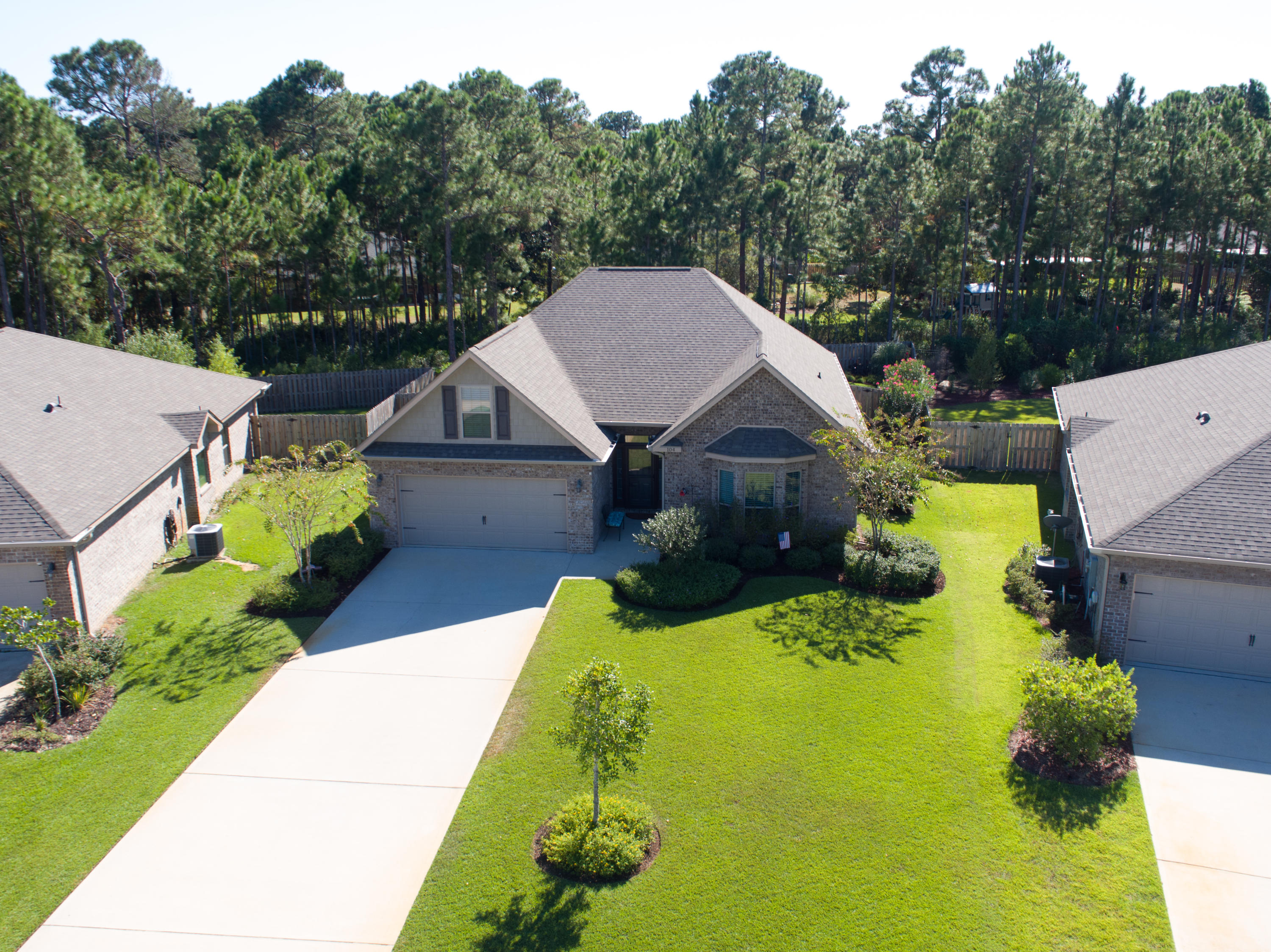 104 Riverbirch Loop Santa Rosa Beach, FL 32459 - Photo 3 of 32 an aerial view of a house with swimming pool and big yard