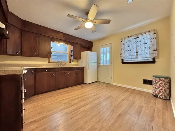 a view of kitchen with furniture and window
