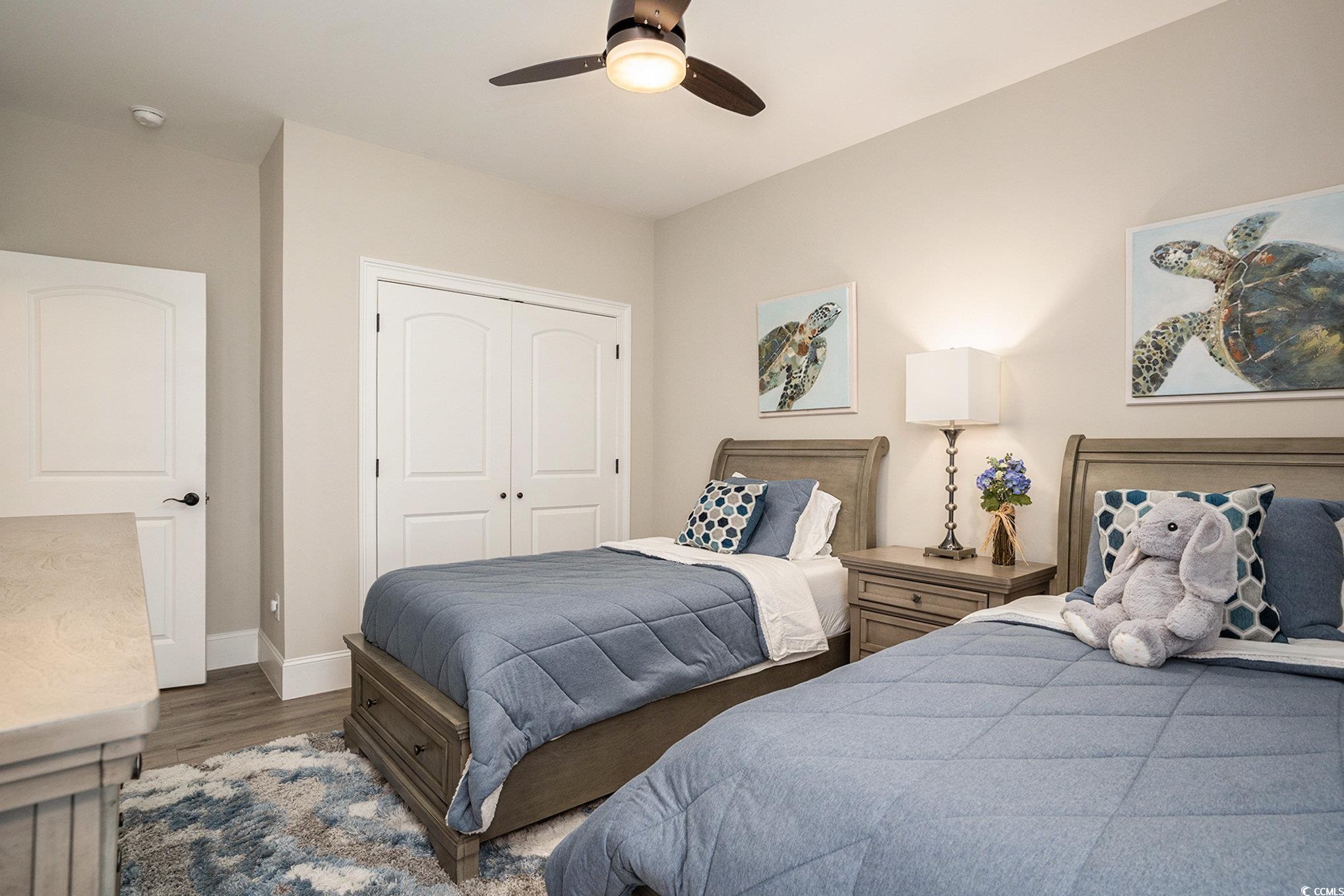 1009 Dowitcher Drive Conway, SC 29526 - Photo 20 of 40 Bedroom featuring a closet, wood finished floors, and ceiling fan