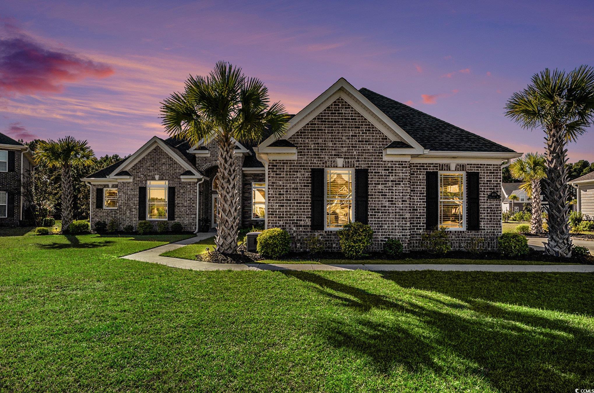 1009 Dowitcher Drive Conway, SC 29526 - Photo 2 of 40 View of front of house with a yard and brick siding