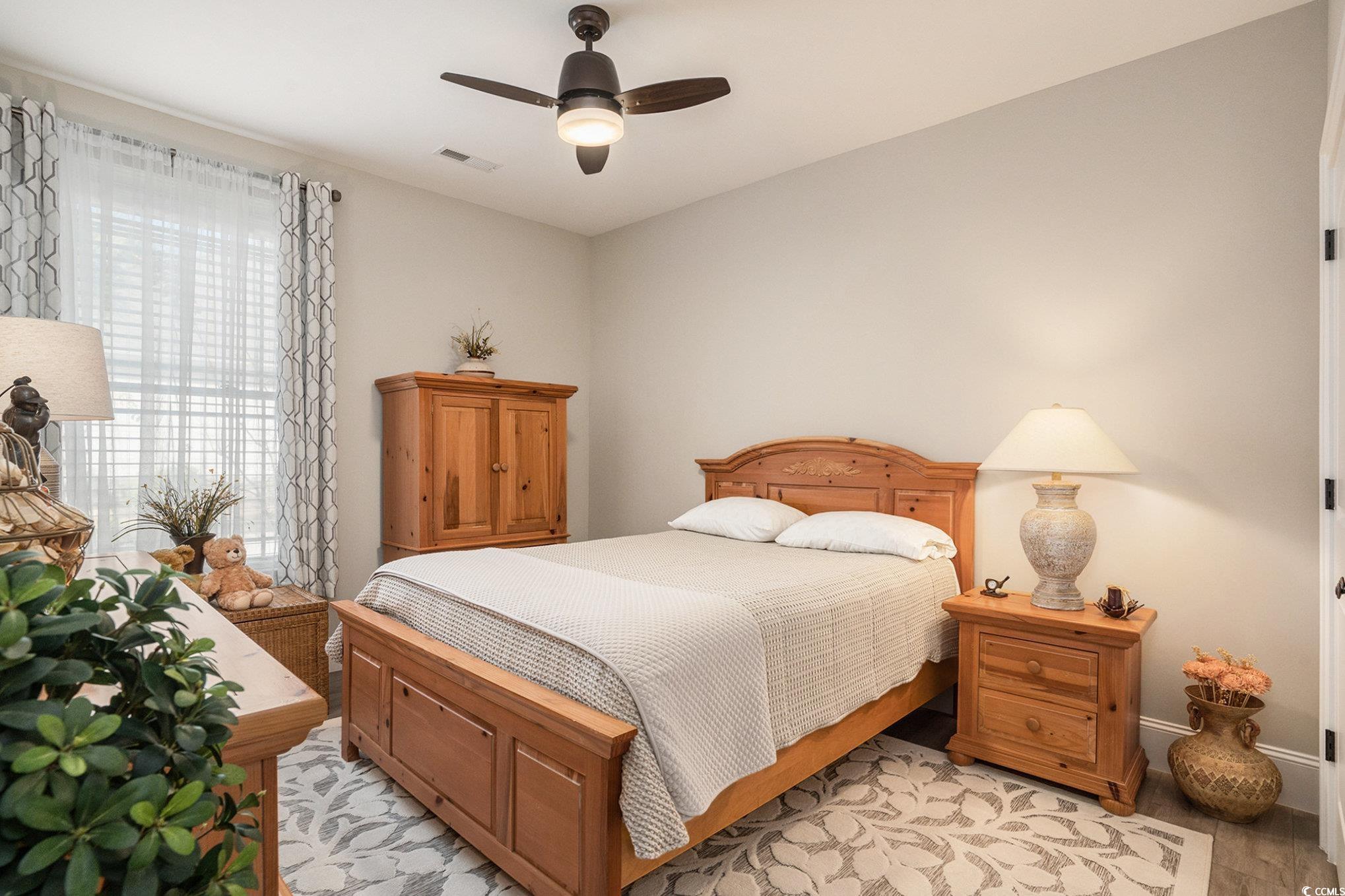 1009 Dowitcher Drive Conway, SC 29526 - Photo 22 of 40 Bedroom with ceiling fan and light wood finished floors