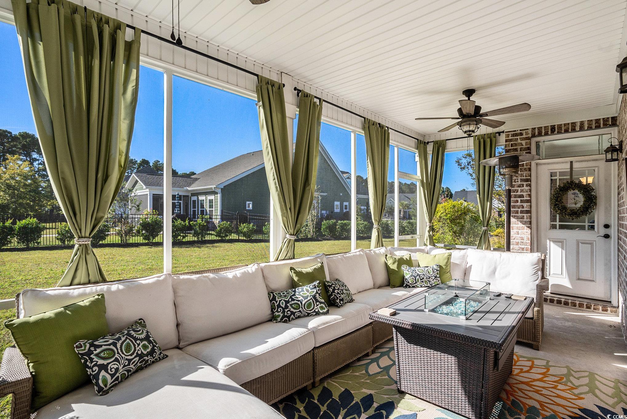 1009 Dowitcher Drive Conway, SC 29526 - Photo 29 of 40 Sunroom with ceiling fan and outdoor lounge area