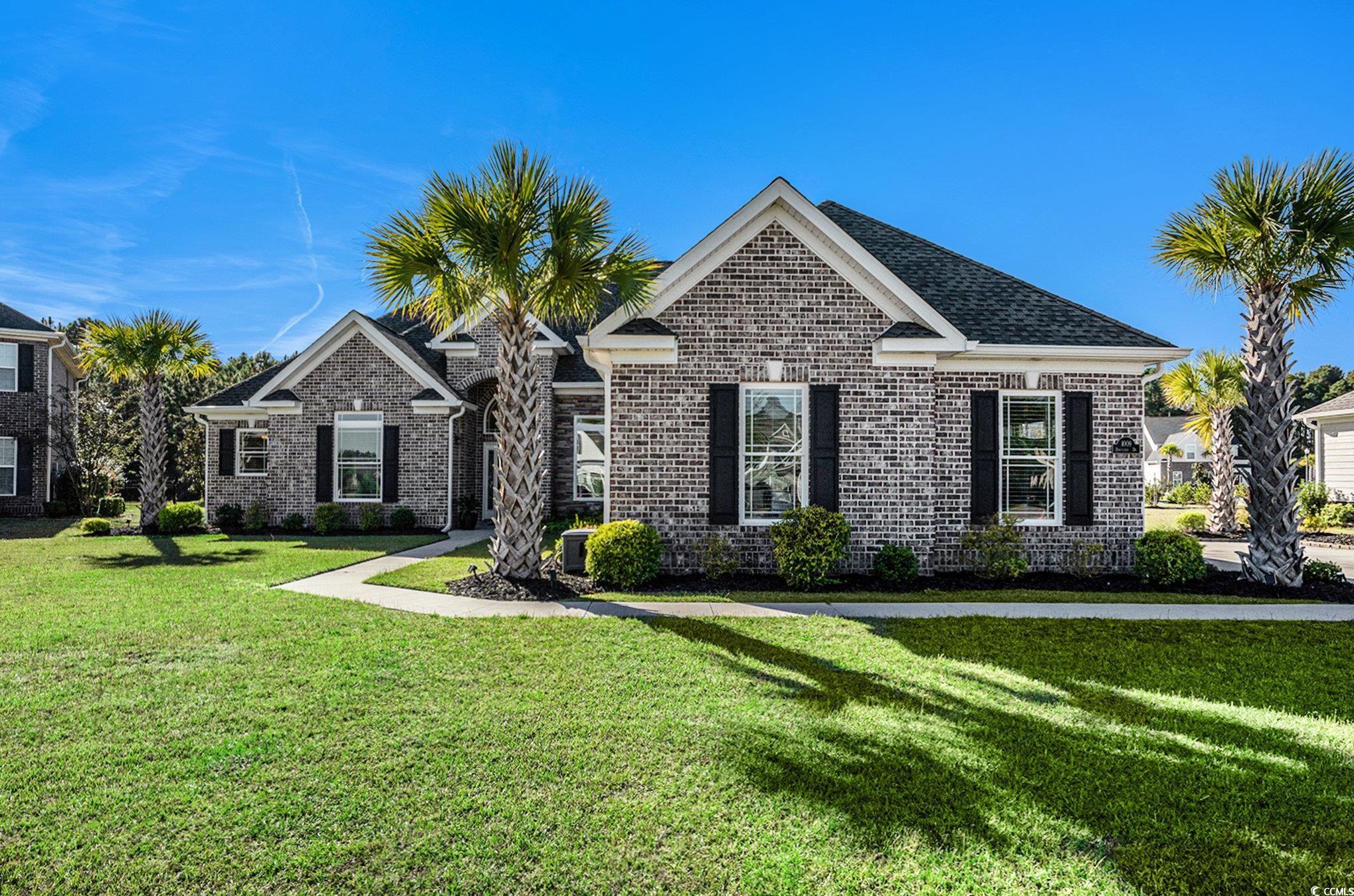 1009 Dowitcher Drive Conway, SC 29526 - Photo 3 of 40 View of front facade with a front yard and brick siding