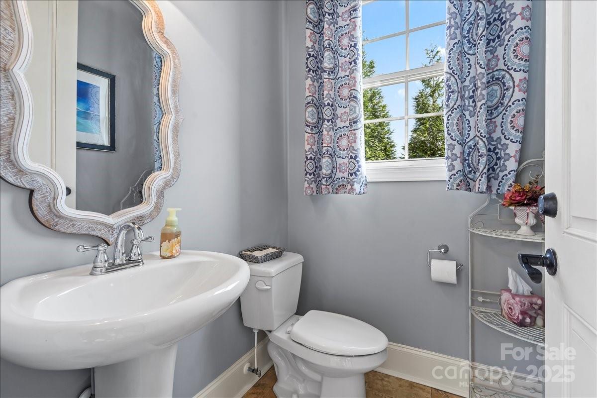 220 Fincher Road Pauline, SC 29374 - Photo 14 of 48 a bathroom with a toilet sink and mirror
