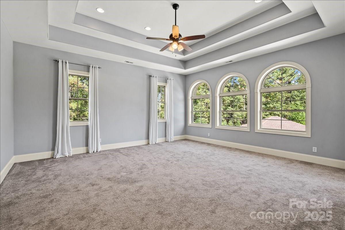 220 Fincher Road Pauline, SC 29374 - Photo 18 of 48 an empty room with windows and chandelier