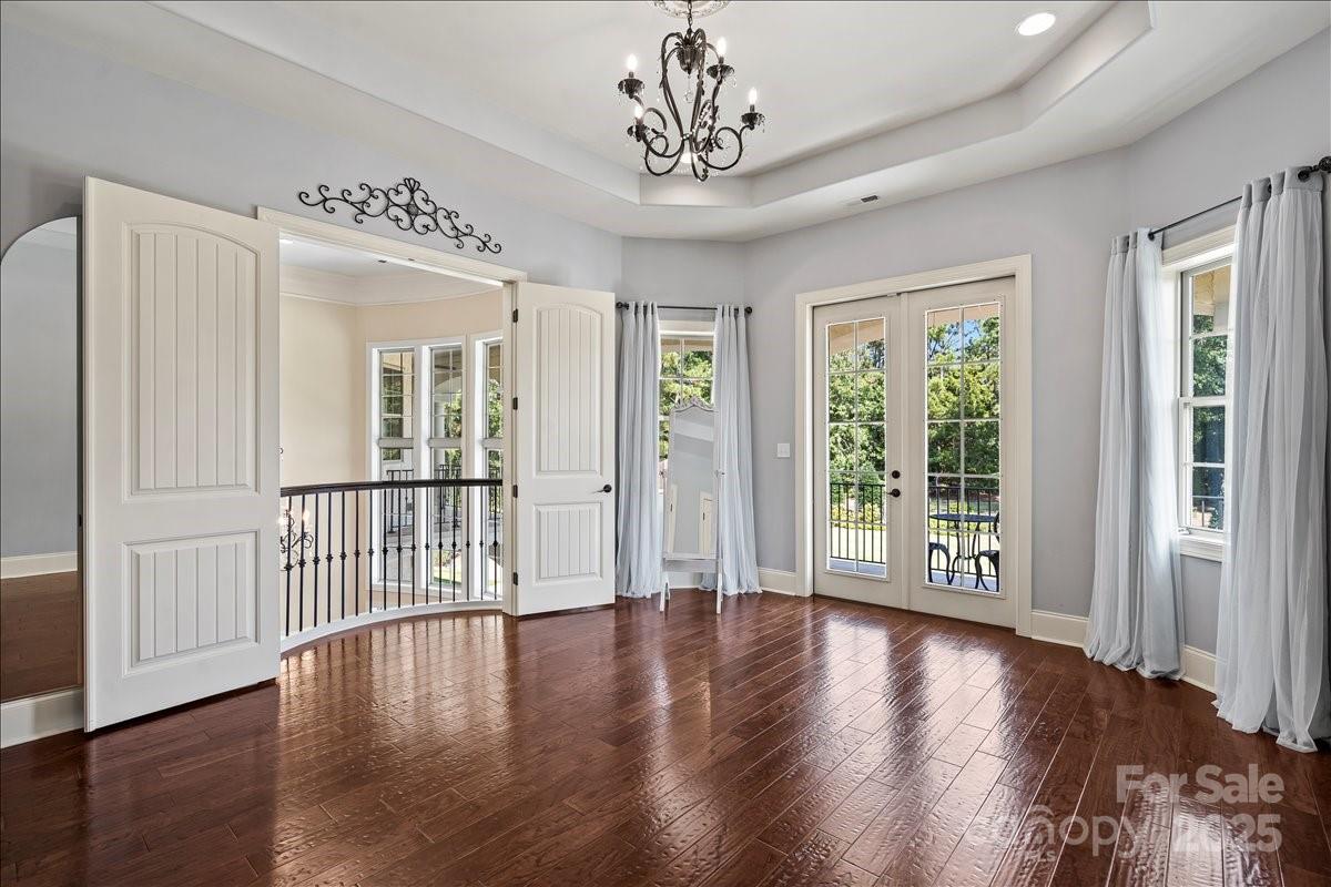 220 Fincher Road Pauline, SC 29374 - Photo 25 of 48 a view of a livingroom with wooden floor windows and a chandelier