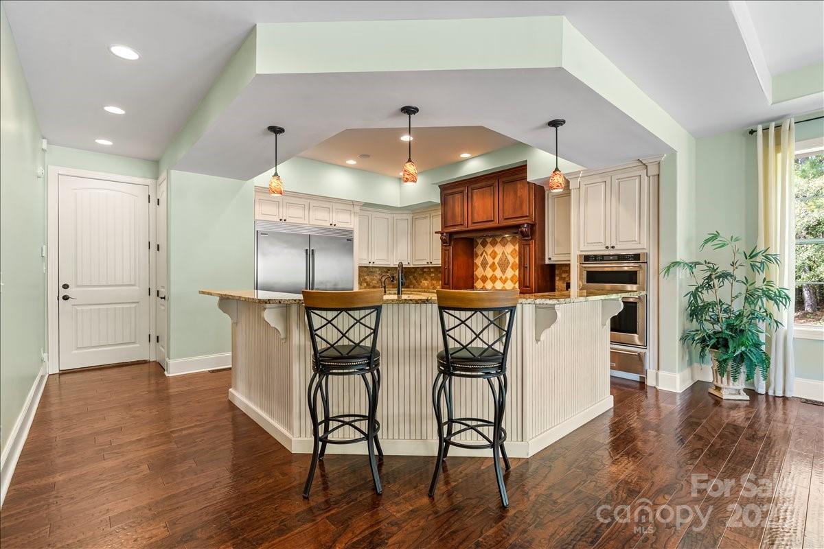 220 Fincher Road Pauline, SC 29374 - Photo 29 of 48 a view of a kitchen with furniture and wooden floor