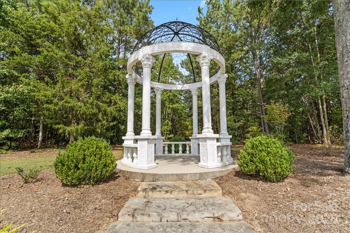 220 Fincher Road Pauline, SC 29374 - Photo 41 of 48 a view of a pathway of a house with a fountain