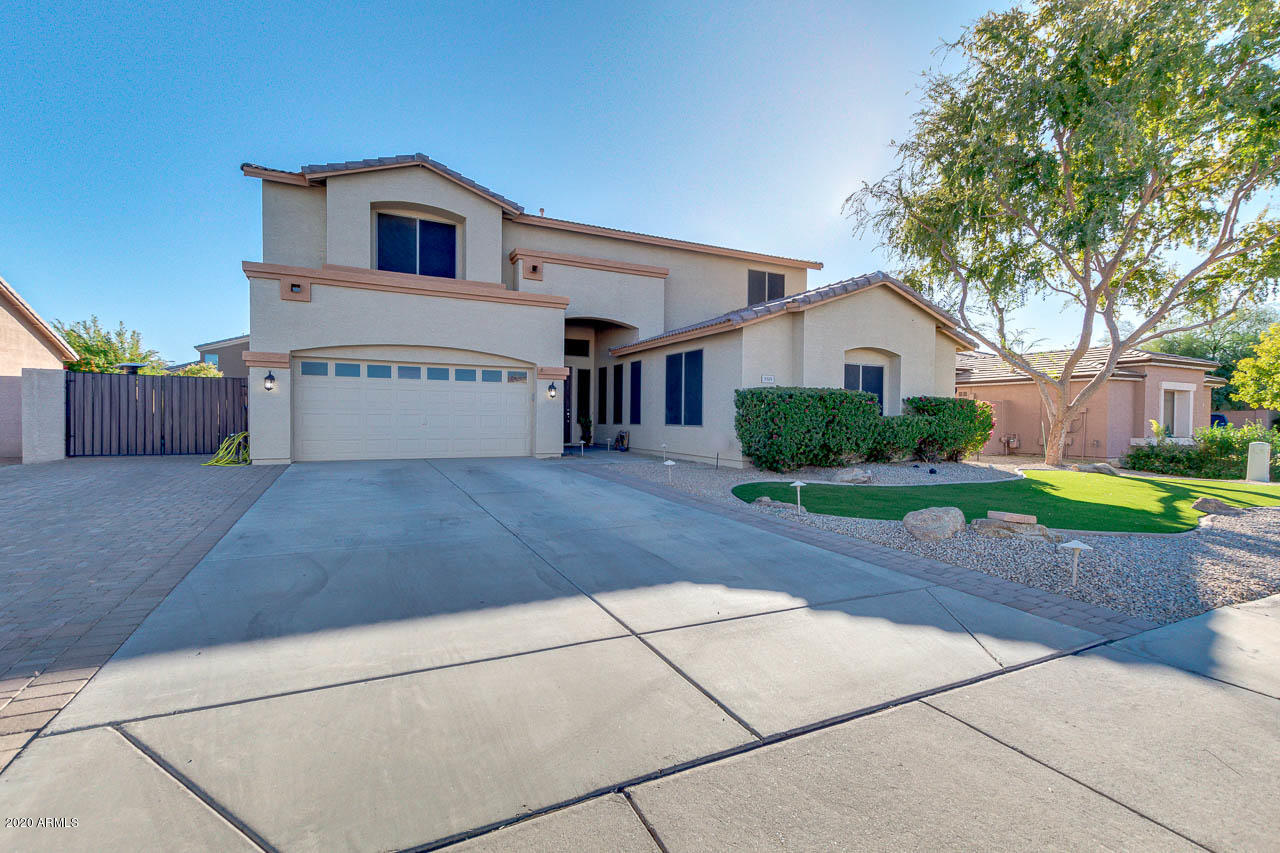 3315 East Los Altos Road Gilbert, AZ 85297 - Photo 2 of 66 a view of a house with a yard