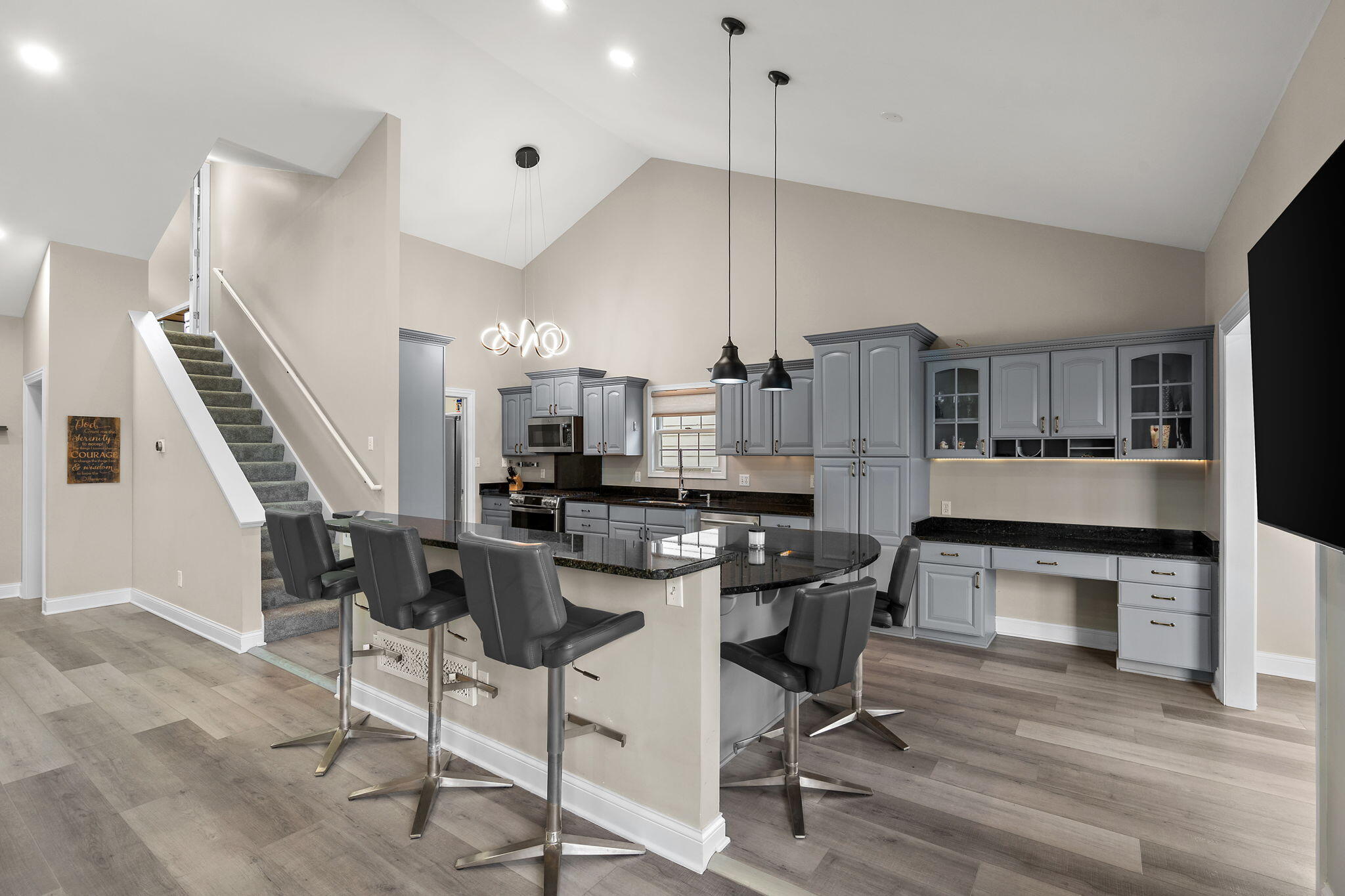 8331 Doubletree Drive North Crown Point, IN 46307 - Photo 12 of 49 a kitchen with stainless steel appliances a stove a table and chairs in it