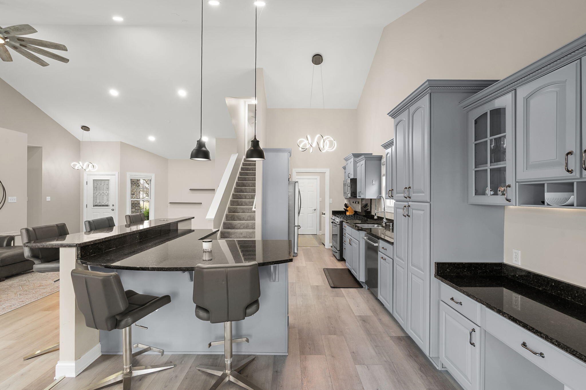 8331 Doubletree Drive North Crown Point, IN 46307 - Photo 13 of 49 a kitchen with stainless steel appliances kitchen island granite countertop a stove a sink and a refrigerator