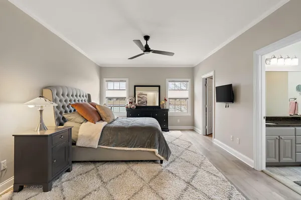 a bed room with a bed and a television