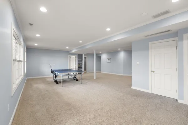an empty room with furniture and windows