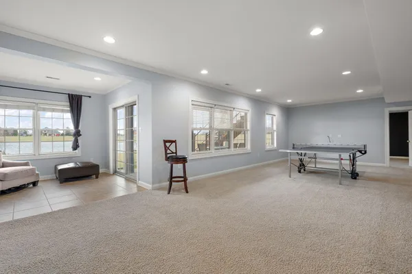 a view of a livingroom with furniture and a window
