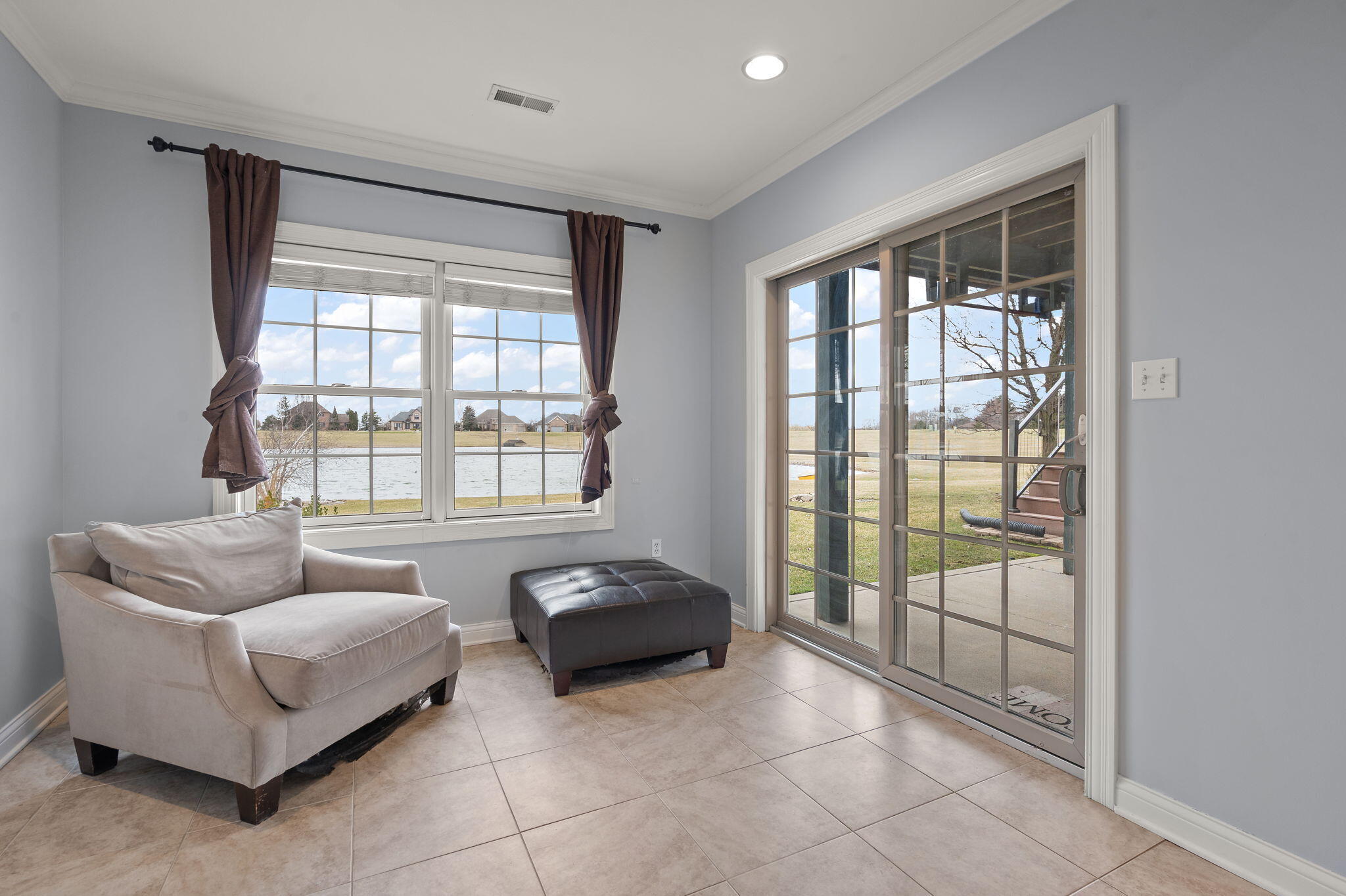 8331 Doubletree Drive North Crown Point, IN 46307 - Photo 32 of 49 a spacious bedroom with a bed and a couch