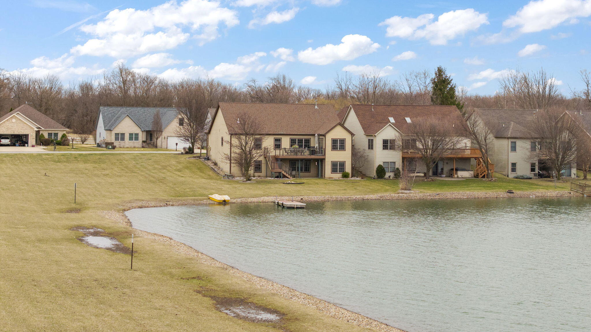 8331 Doubletree Drive North Crown Point, IN 46307 - Photo 47 of 49 a view of swimming pool with a yard and large trees