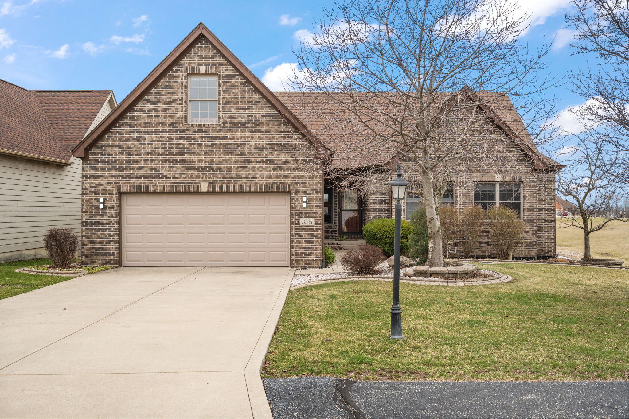 8331 Doubletree Drive North Crown Point, IN 46307 - Photo 48 of 49 a front view of a house with garden