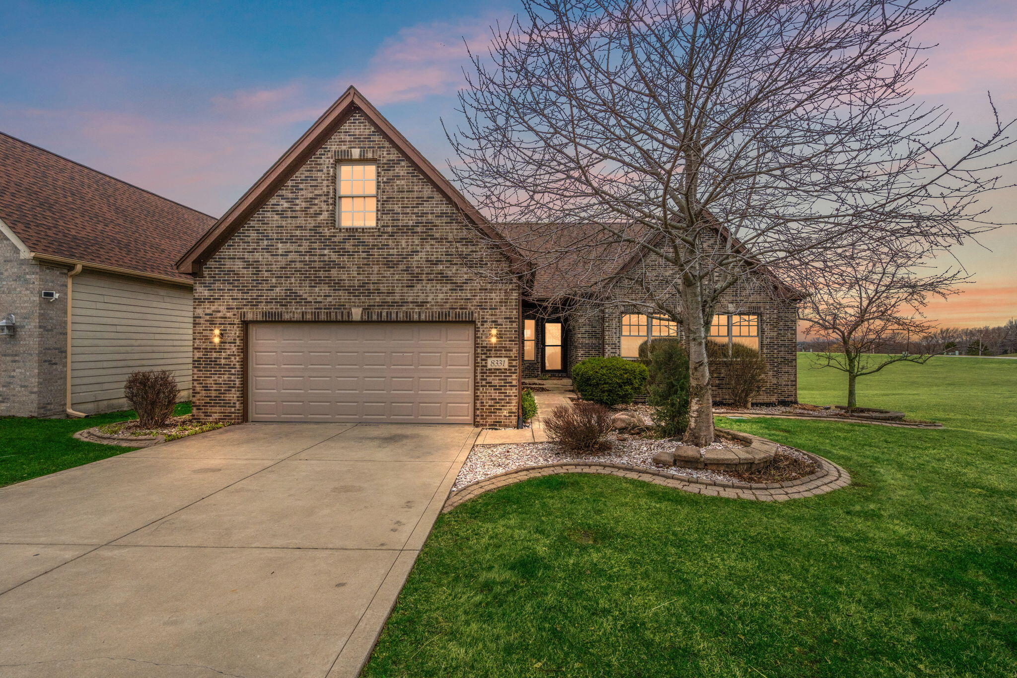 8331 Doubletree Drive North Crown Point, IN 46307 - Photo 49 of 49 a front view of a house with garden