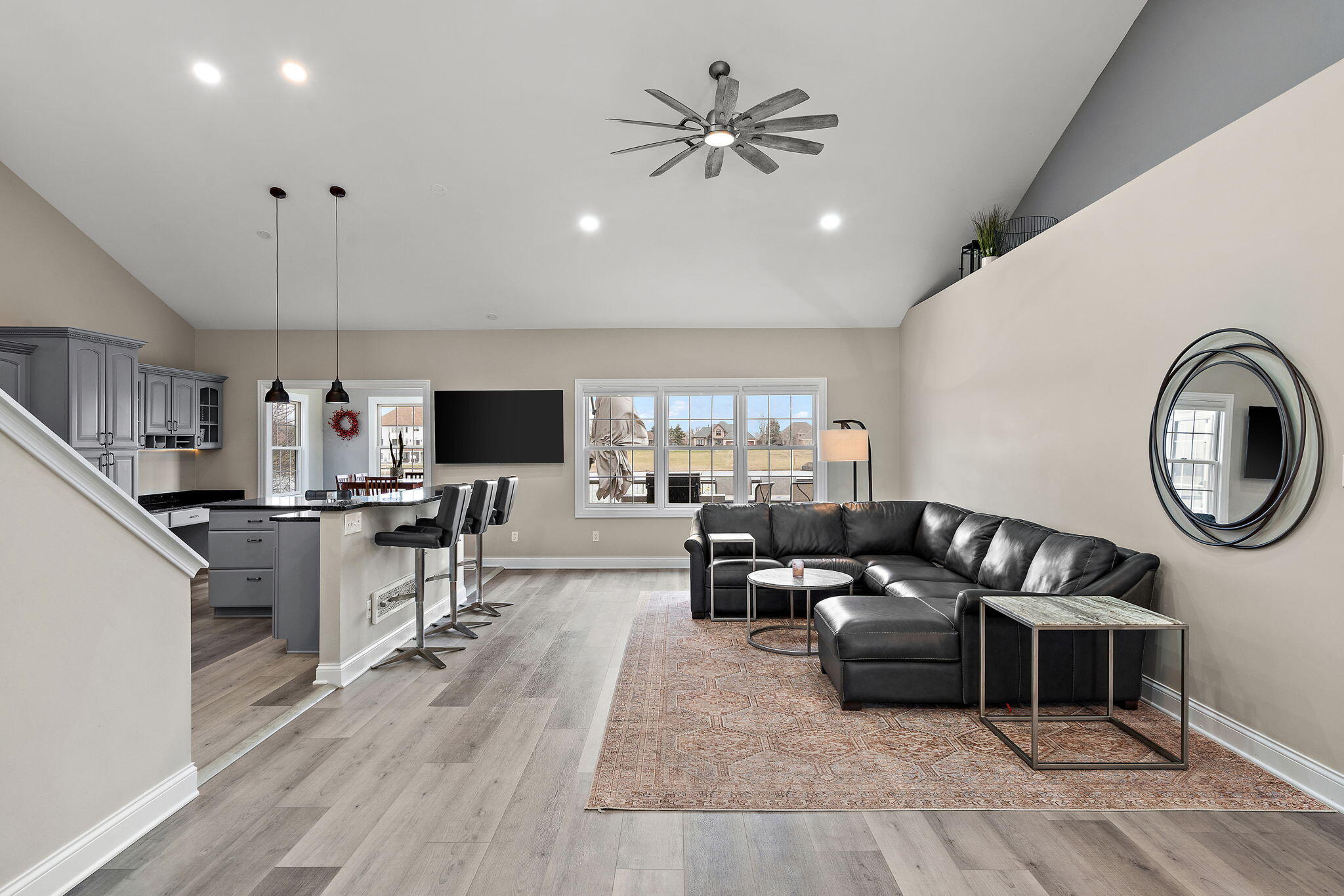 8331 Doubletree Drive North Crown Point, IN 46307 - Photo 8 of 49 a living room with furniture a flat screen tv and kitchen view