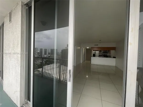 a view of entryway and kitchen