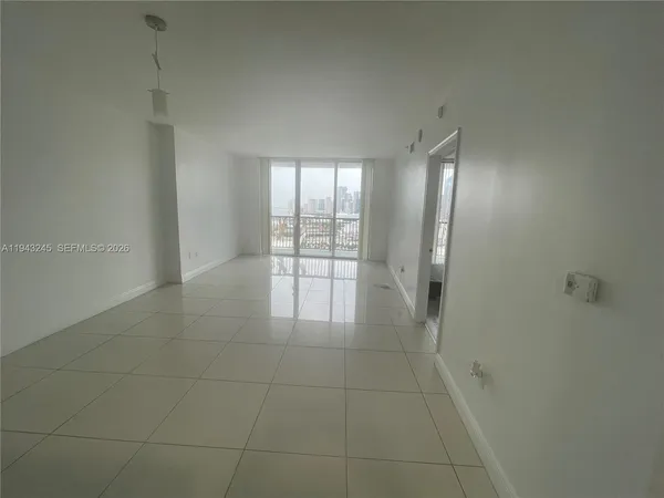 a view of an empty room and window