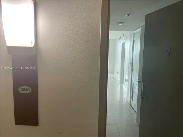 a bathroom with a shower and a mirror
