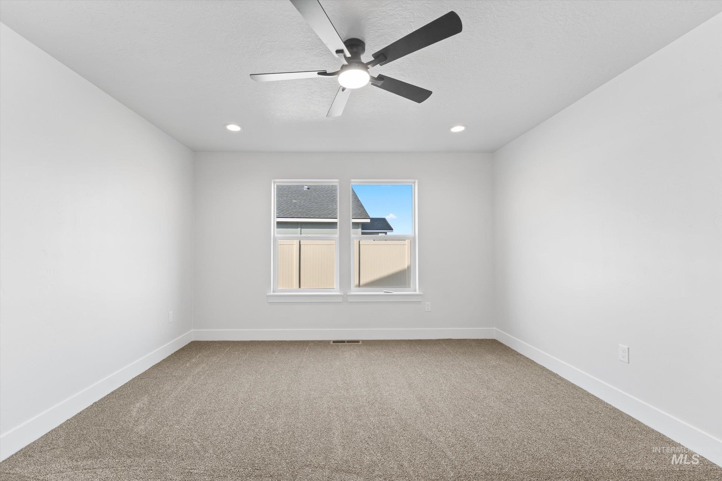 1142 Velvet Loop Wilder, ID 83676 - Photo 15 of 27 Spare room featuring light colored carpet and ceiling fan