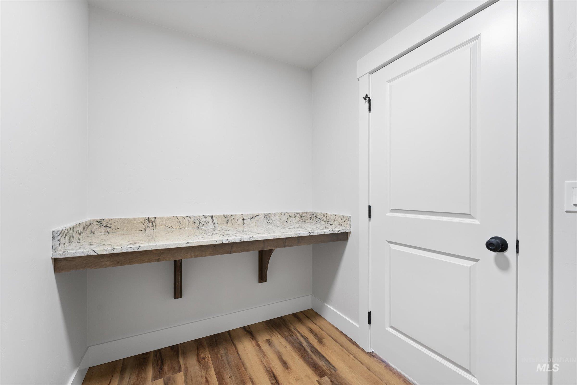 1142 Velvet Loop Wilder, ID 83676 - Photo 18 of 27 Laundry area with light wood-style floors and baseboards