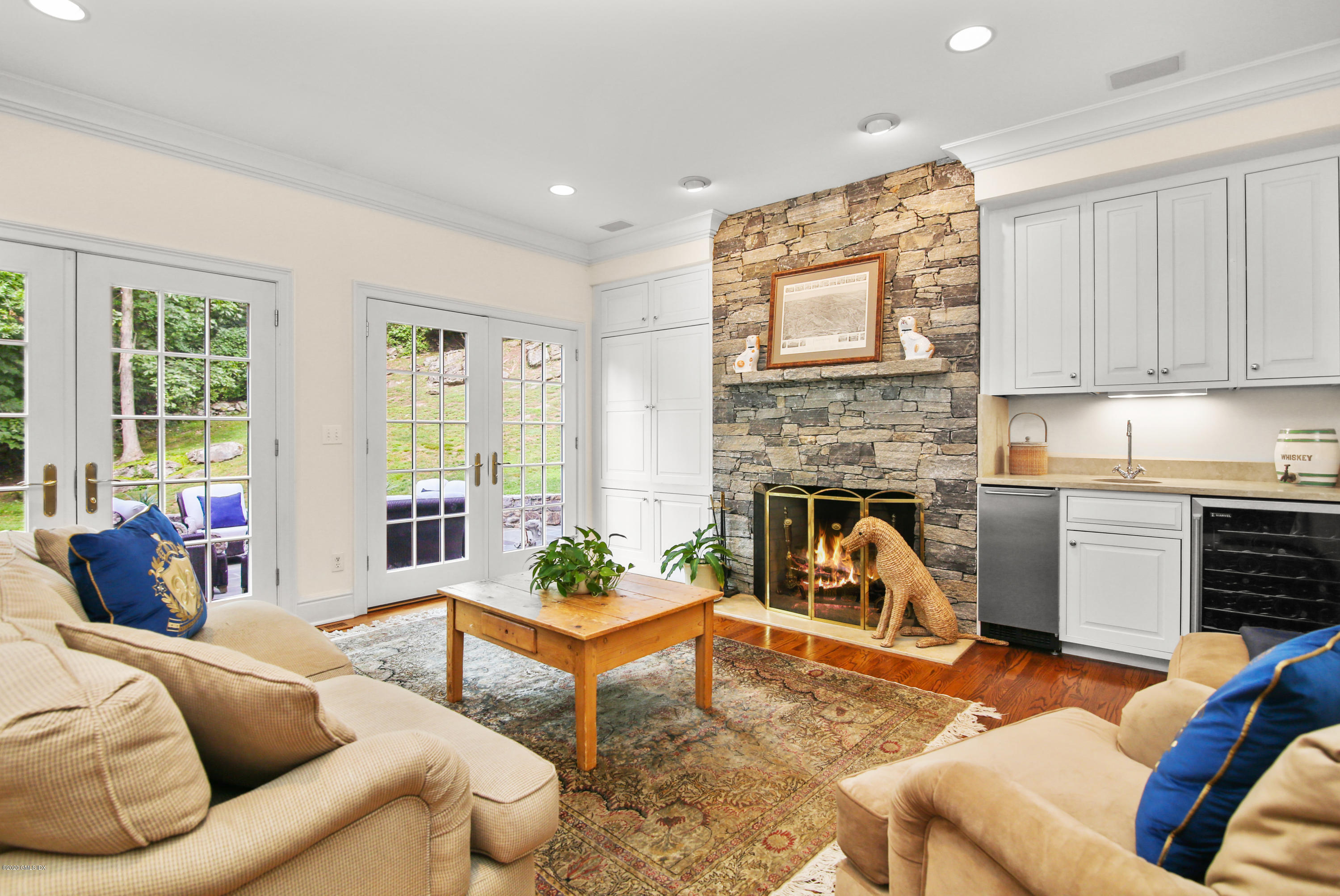 82 Round Hill Road Greenwich, CT 06831 - Photo 11 of 19 a living room with furniture and a fireplace
