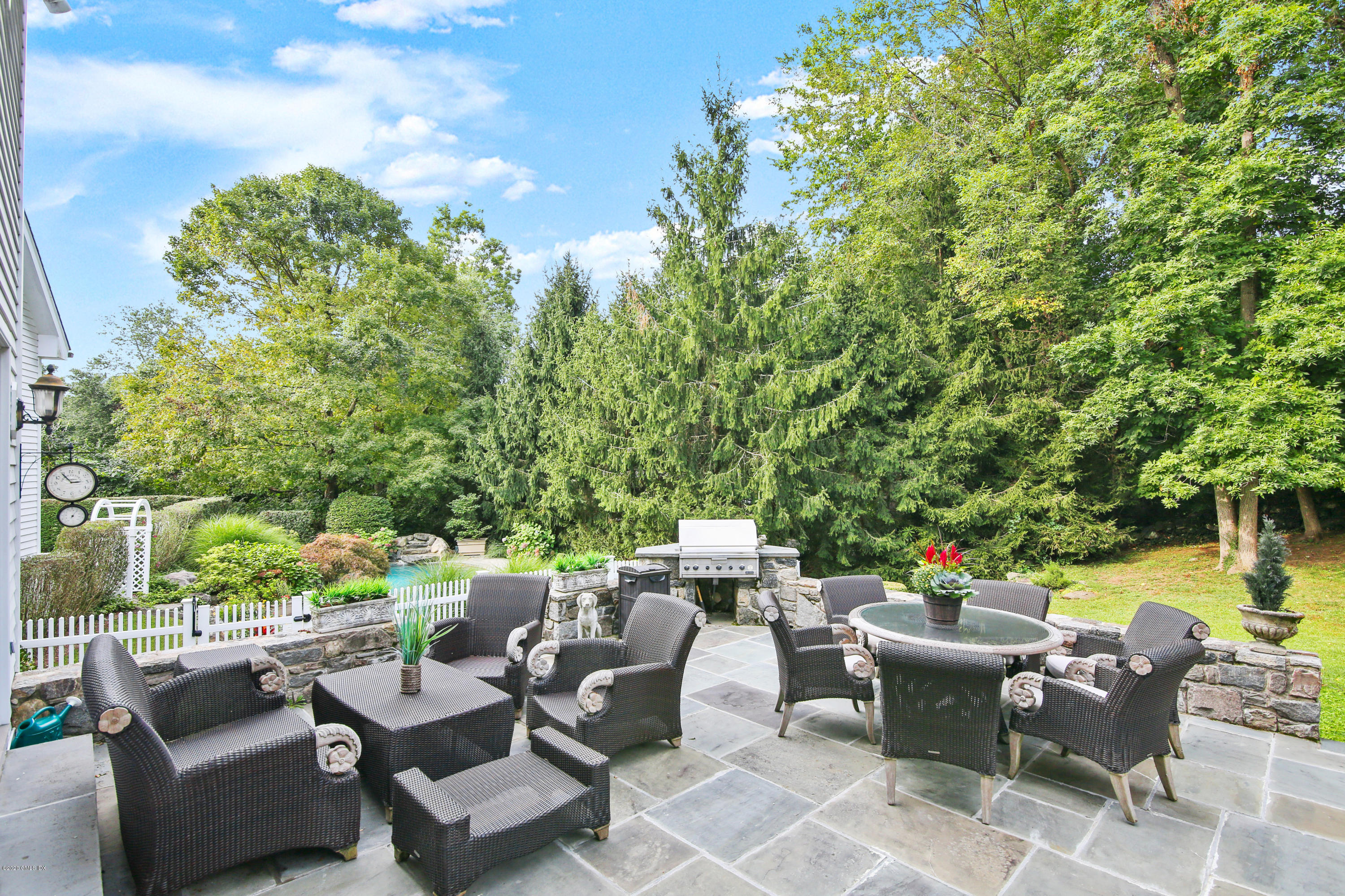 82 Round Hill Road Greenwich, CT 06831 - Photo 16 of 19 a patio with patio a couch and chairs