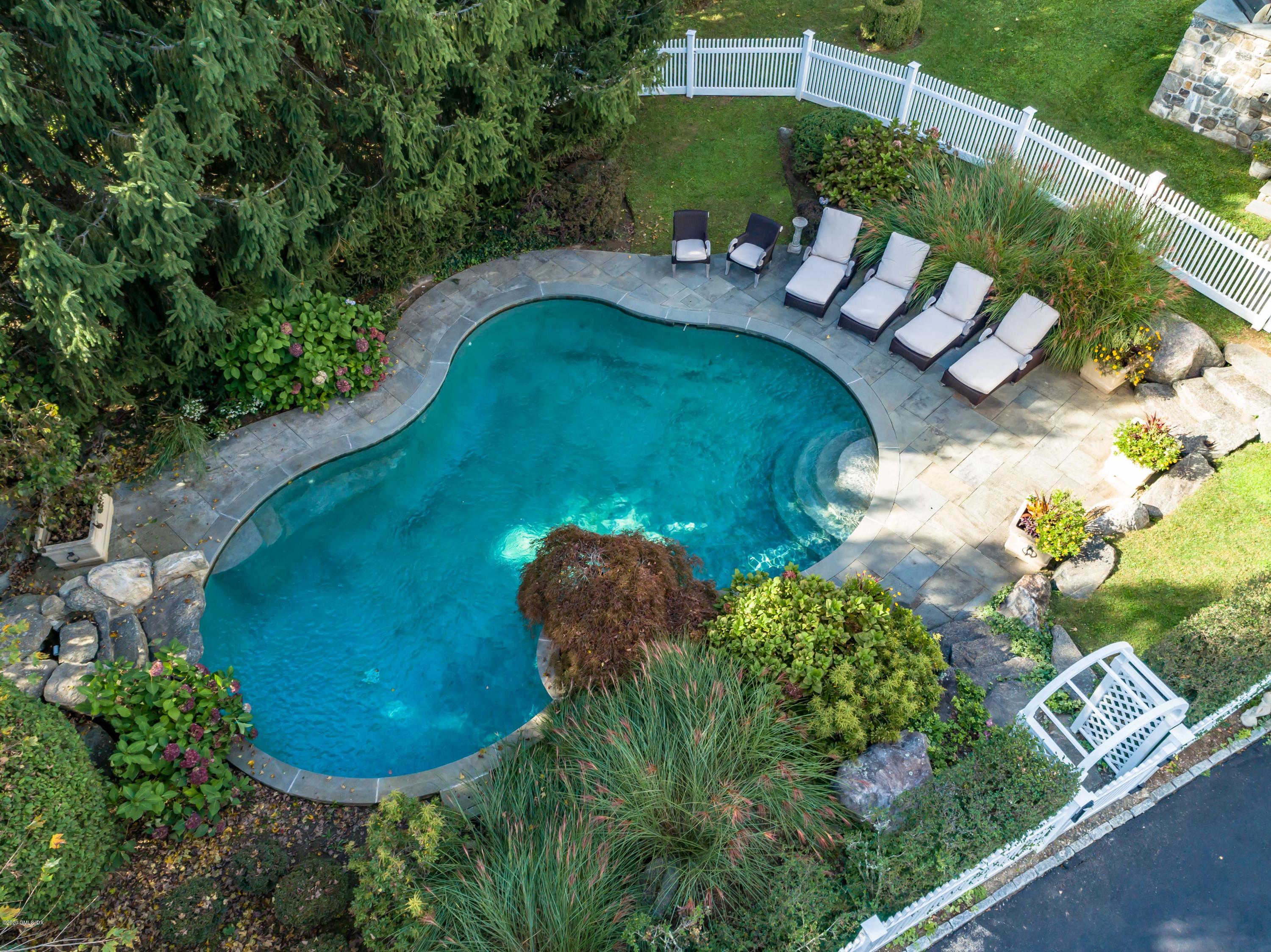 82 Round Hill Road Greenwich, CT 06831 - Photo 17 of 19 a view of a backyard