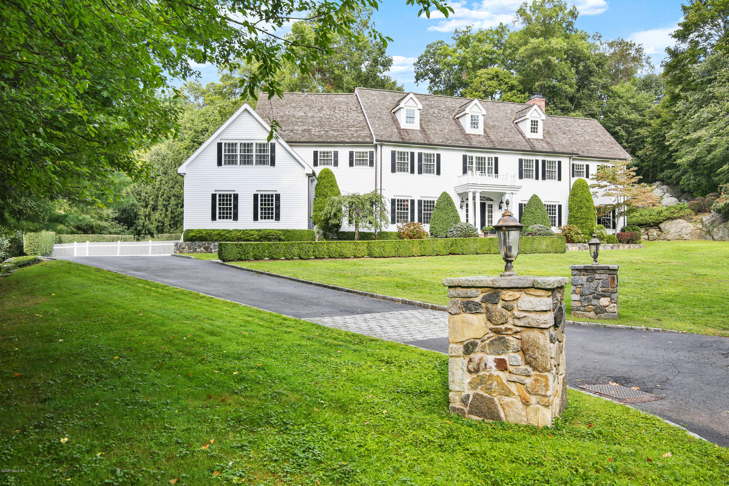 82 Round Hill Road Greenwich, CT 06831 - Photo 19 of 19 a view of a house with a yard porch and sitting area
