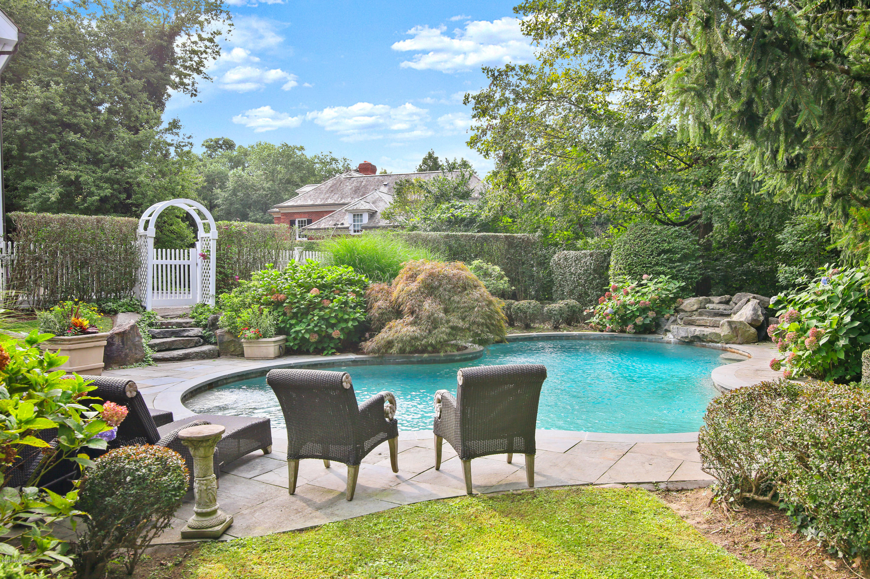 82 Round Hill Road Greenwich, CT 06831 - Photo 3 of 19 a view of a chairs and table in the patio
