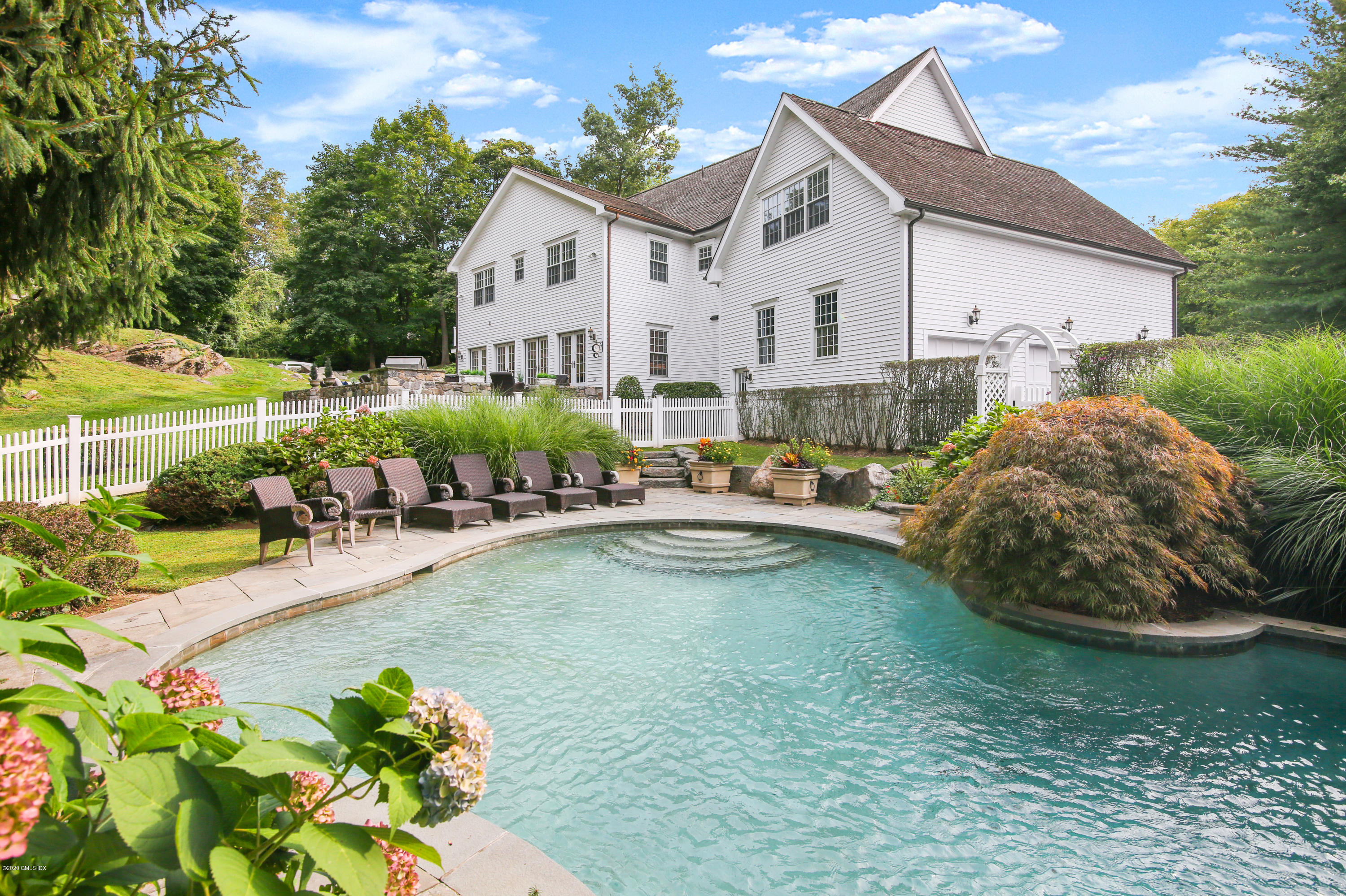 82 Round Hill Road Greenwich, CT 06831 - Photo 4 of 19 a view of a house with a yard patio and sitting area
