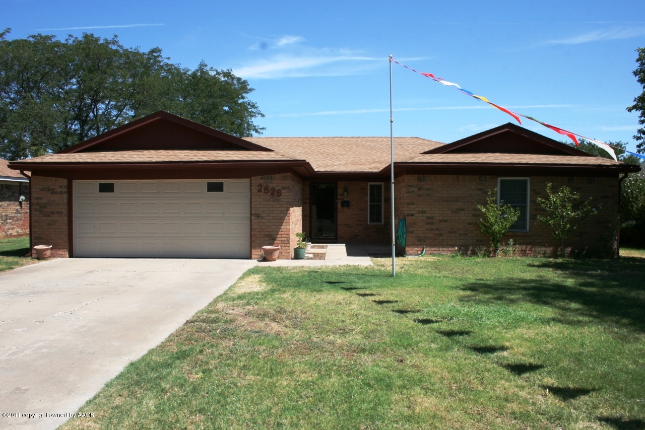 2826 Lloyd Drive Amarillo, TX 79110 - Photo 1 of 18 a front view of a house with a garden