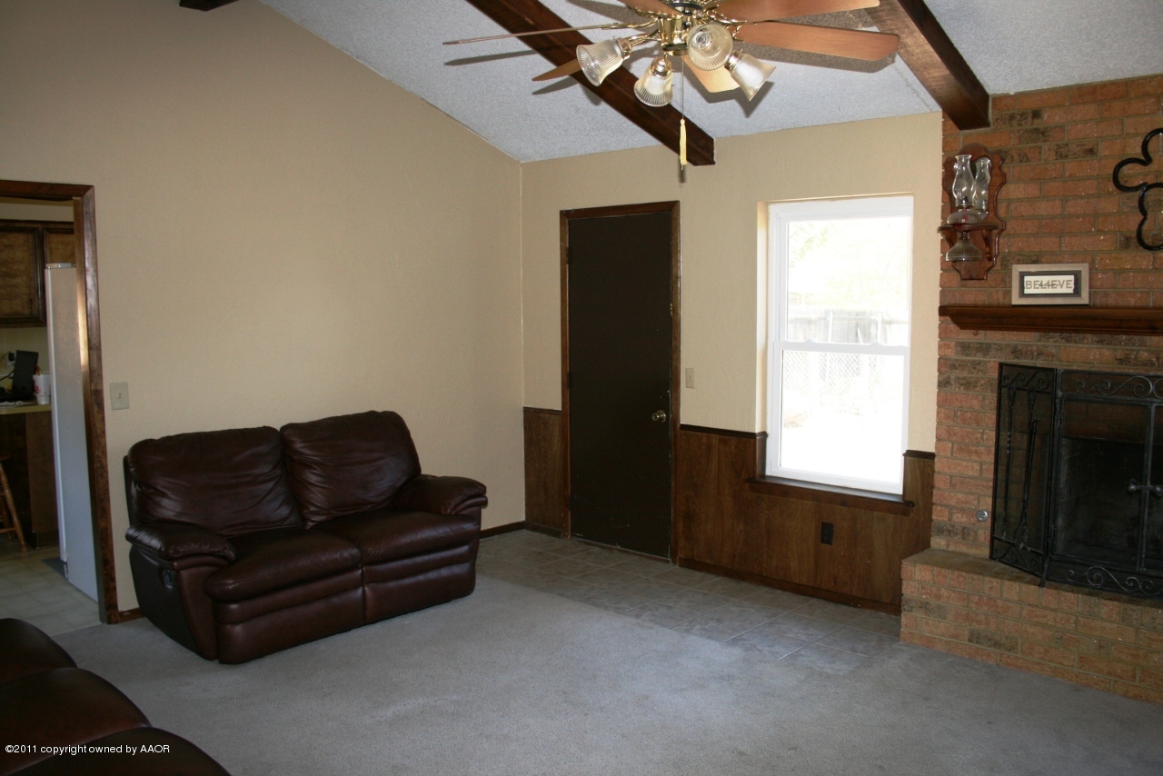 2826 Lloyd Drive Amarillo, TX 79110 - Photo 2 of 18 a living room with furniture and a fireplace
