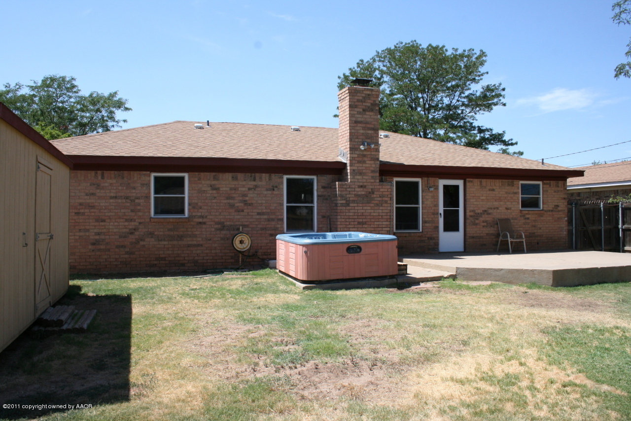 2826 Lloyd Drive Amarillo, TX 79110 - Photo 16 of 18 a front view of a house with a garden