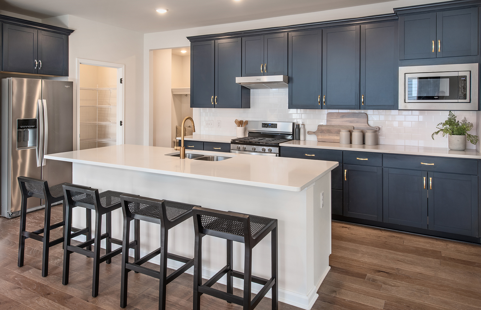 3300 Wildlight Road Aurora, IL 60503 - Photo 2 of 21 a kitchen with a table chairs refrigerator and cabinets