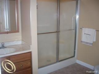 8090 Ruger Ridge Fowlerville, MI 48836 - Photo 14 of 17 8090 inlaw bath.jpg