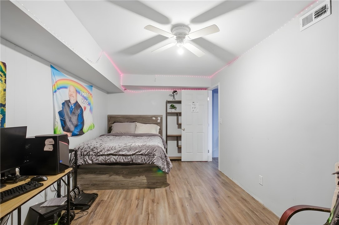 311 Cumberland Way Anderson, SC 29621 - Photo 27 of 44 A well-lit sleeping area showcasing resilient flooring and a ceiling fan.