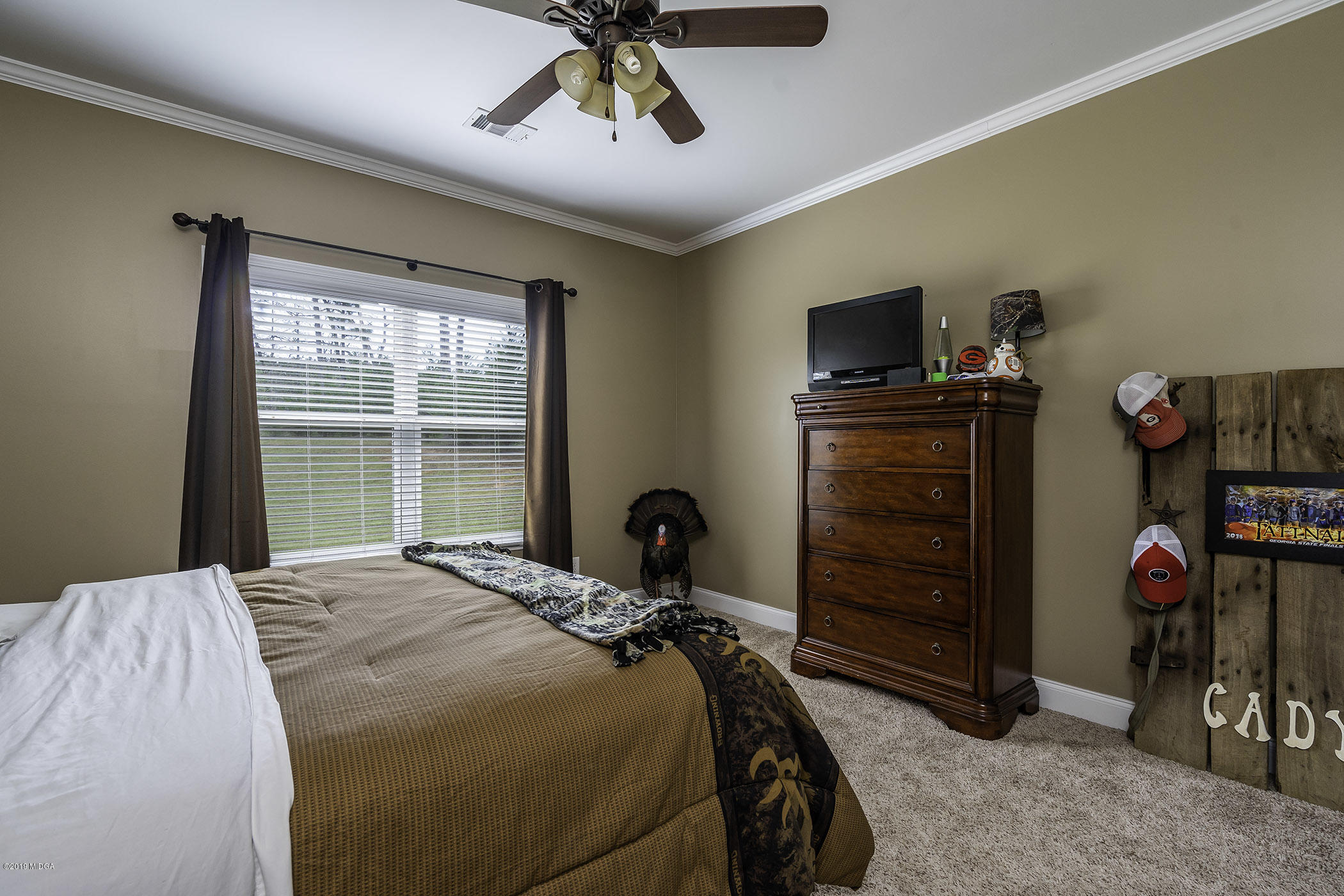 125 Rivers Edge Drive Forsyth, GA 31029 - Photo 17 of 21 a bedroom with a bed and a window