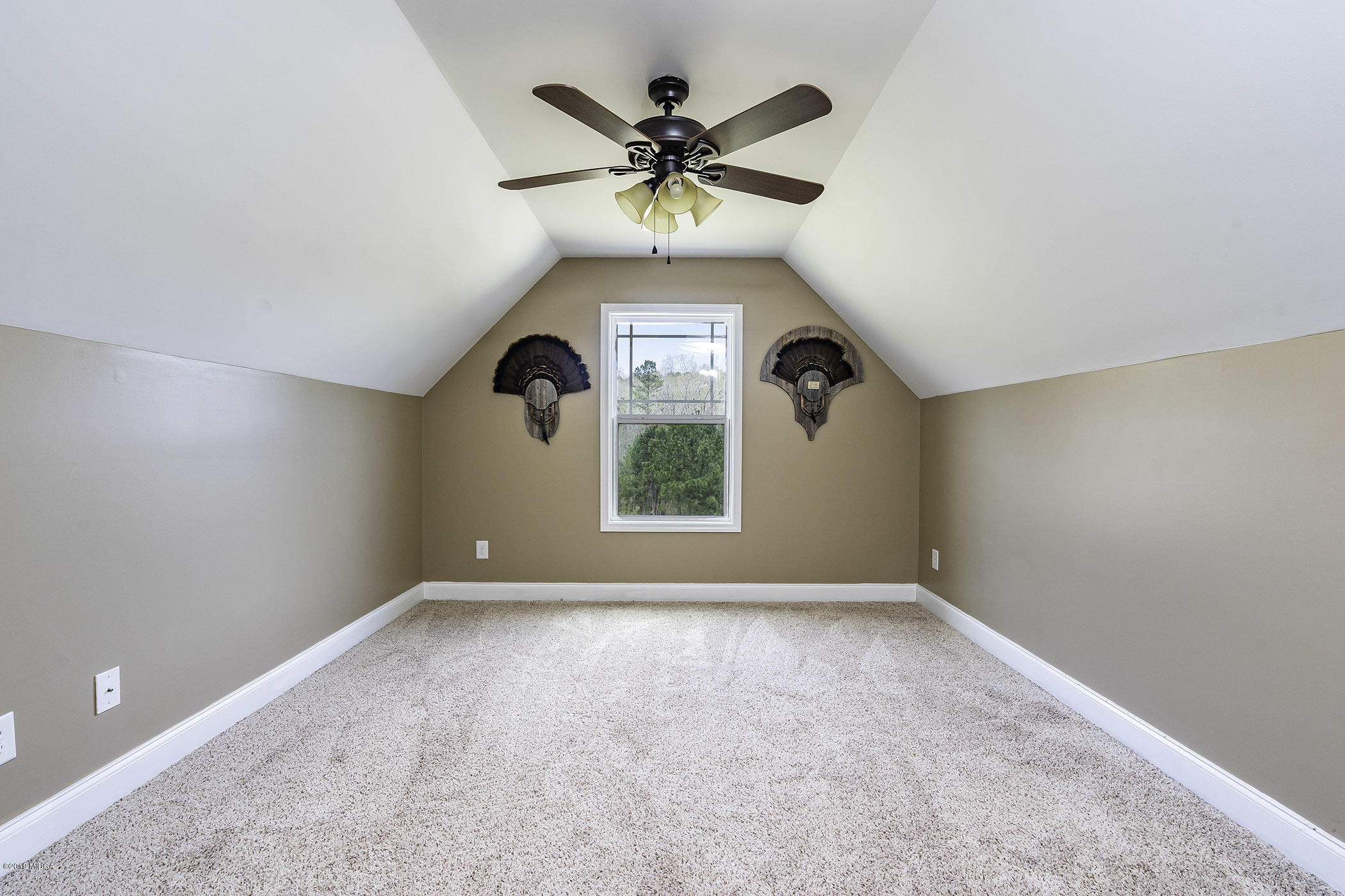 125 Rivers Edge Drive Forsyth, GA 31029 - Photo 21 of 21 a view of an empty room with a window